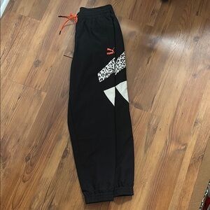 PUMA Women's Sportswear Tailored For Sports Woven Track Pants